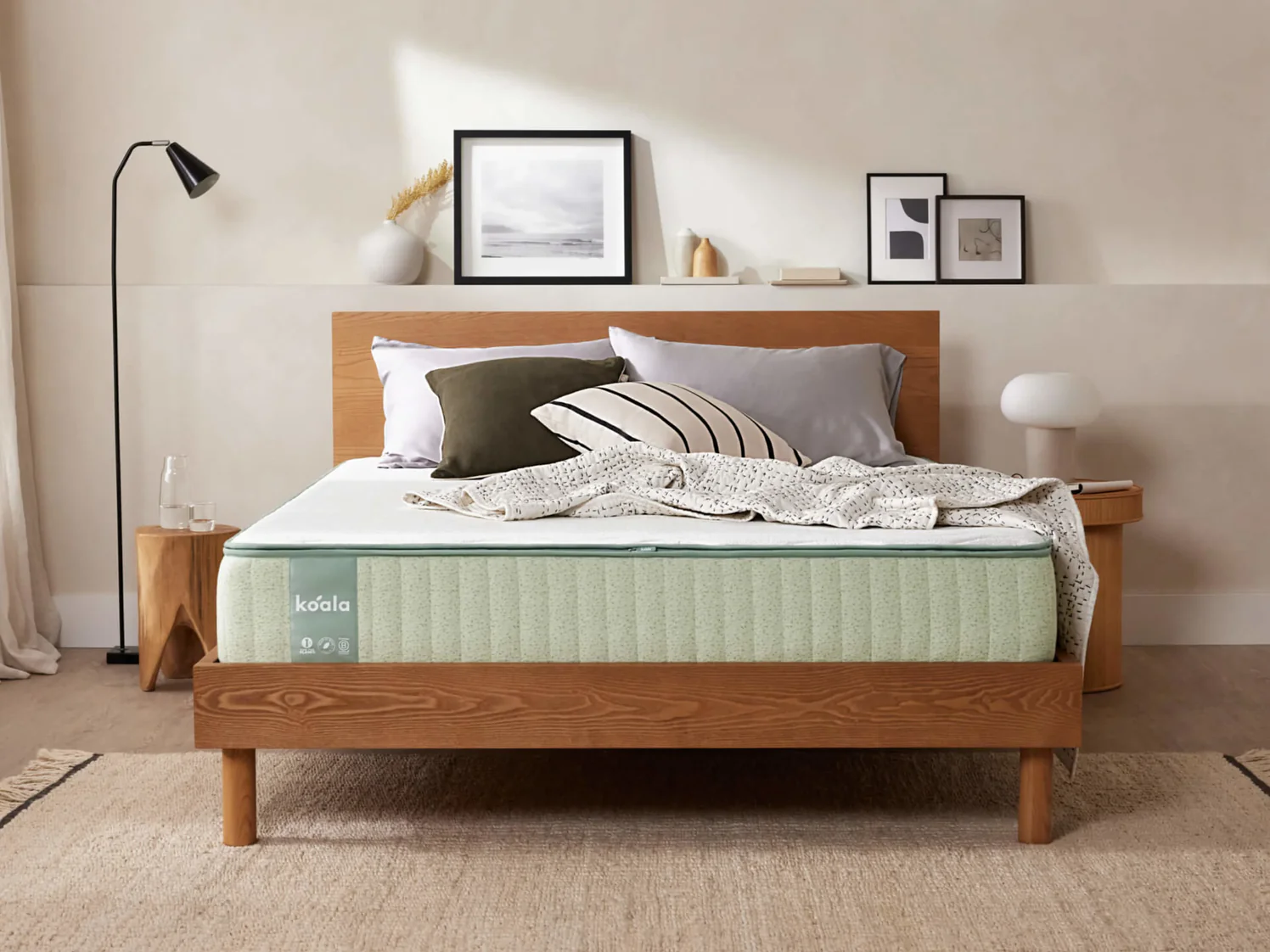 Mattress on wooden bed frame in modern bedroom.