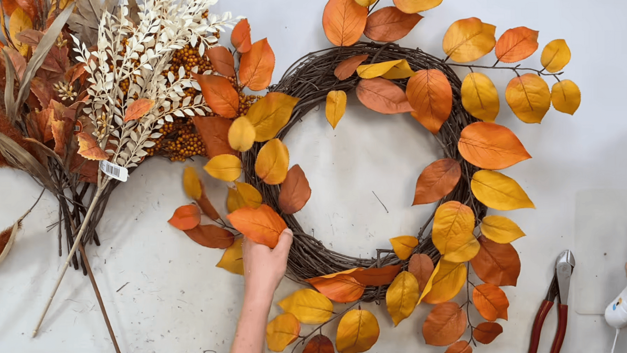 create the base layer With orange and brown leaves