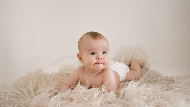 when do babies start rolling over