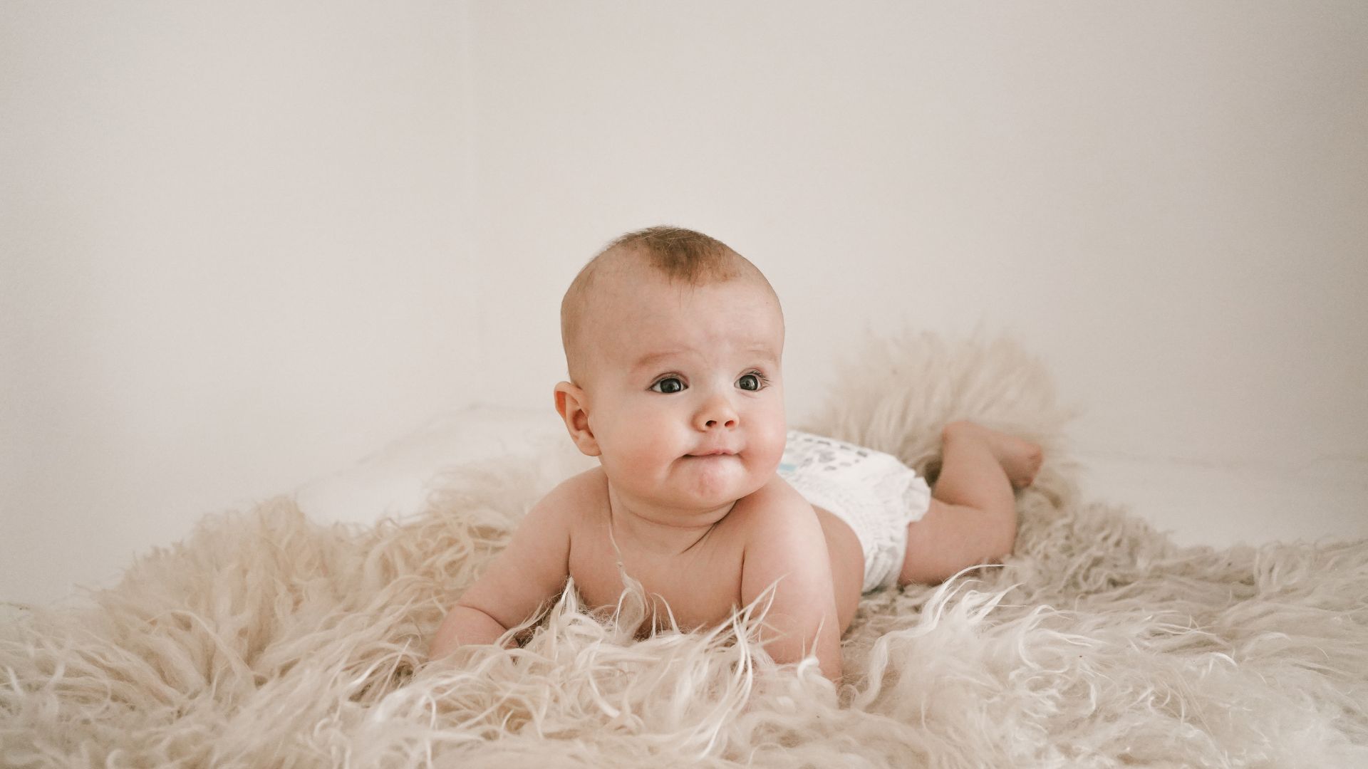 when do babies start rolling over